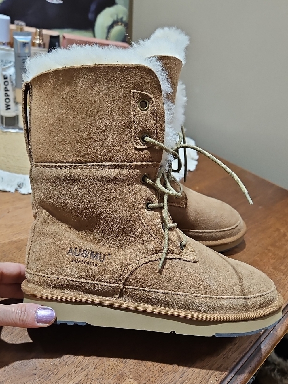 These are the AU&MU Australia shearling and suede mid-calf lace-up boots in tan